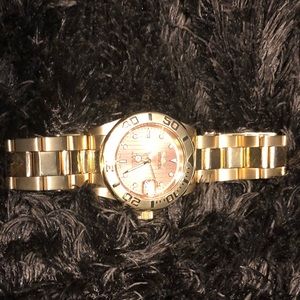 Women’s Invicta watch gold tone
